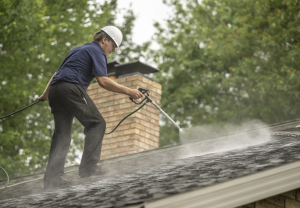 Amish Roofer Spraying Rejuvenation Product